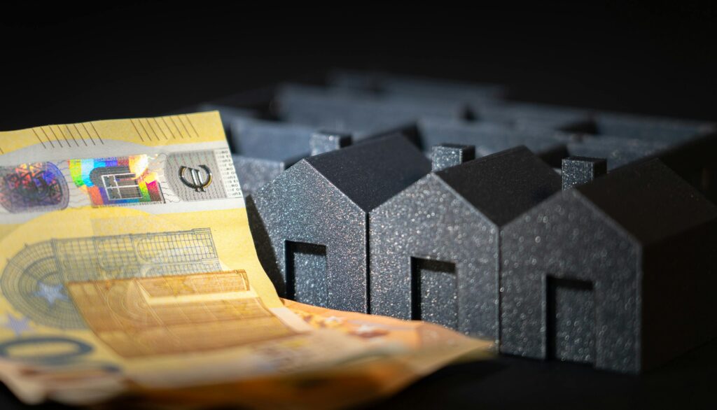 Housing estate model. Business finance cash banknotes. Euro currency.
