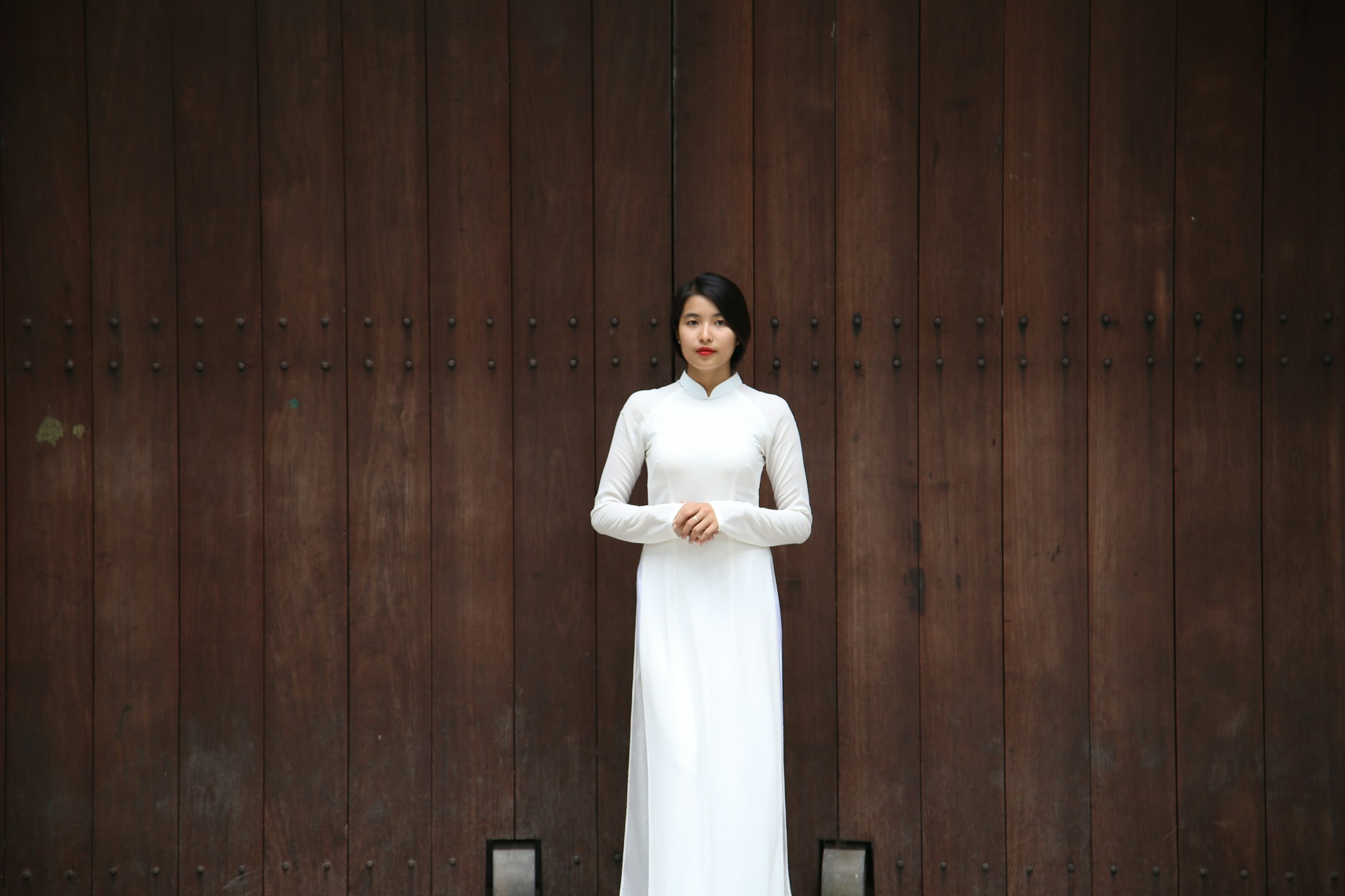 woman in white near building