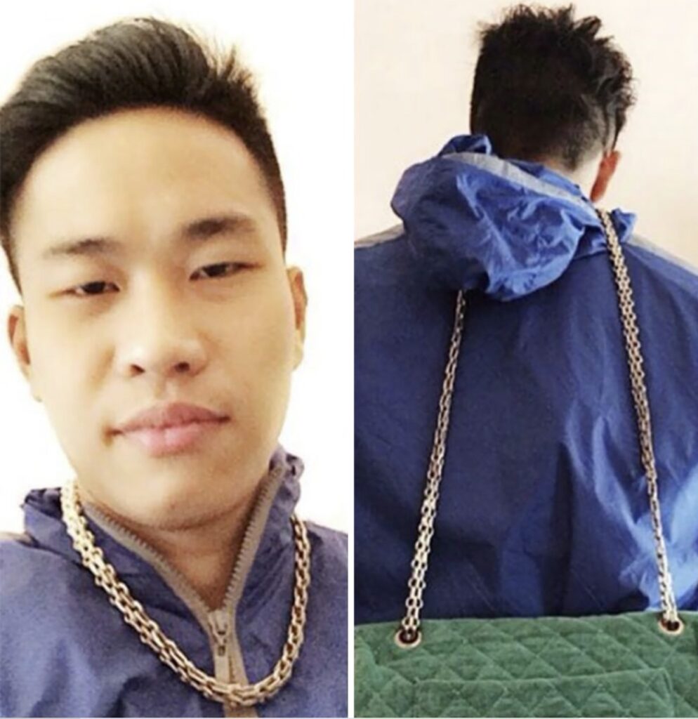 man wearing gold chain