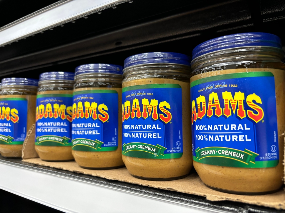 Edmonton, Canada - July 15, 2024: Diminishing perspective of Adams peanut butter on display on a store shelf