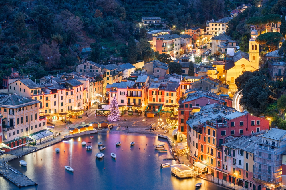 Portofino, Italy fishing village and commune in the Metropolitan City of Genova at dusk.