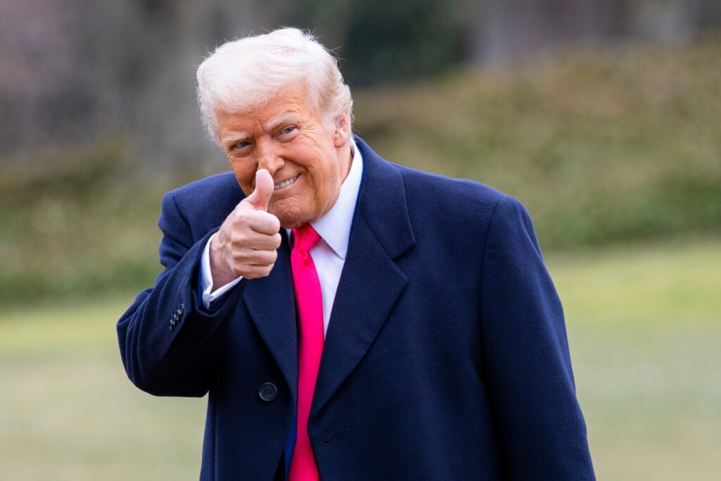 WASHINGTON – February 22, 2025: President Donald Trump gives a thumbs up on the South Lawn as he walks into the White House.