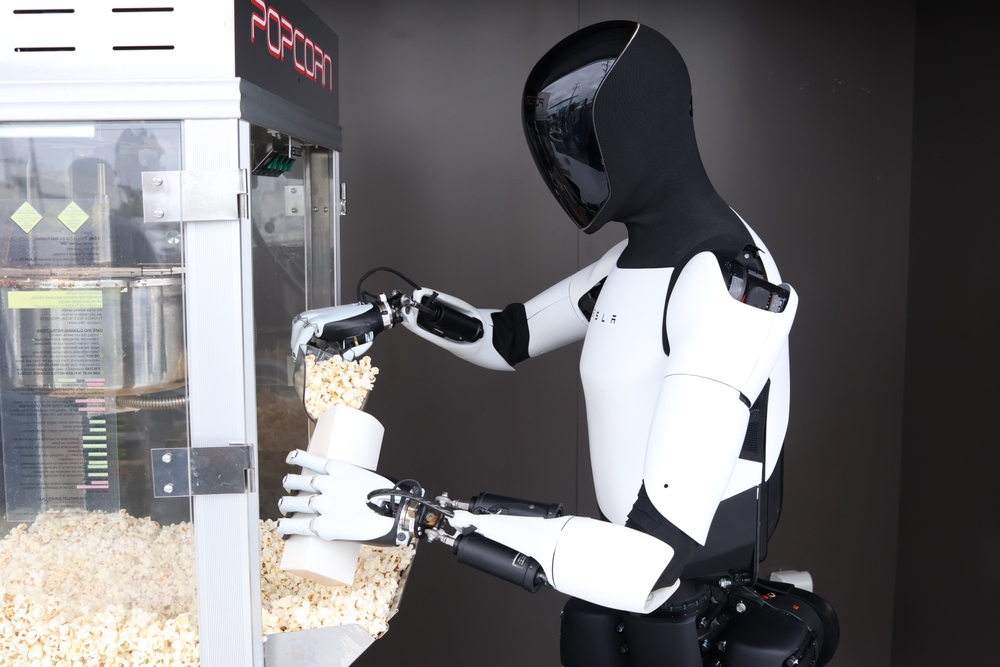 Los Angeles, CA, USA - July 21, 2025: A Optimus Humanoid Robot Serves Popcorn to Patrons at The First Ever TESLA DINER on Opening Day.
