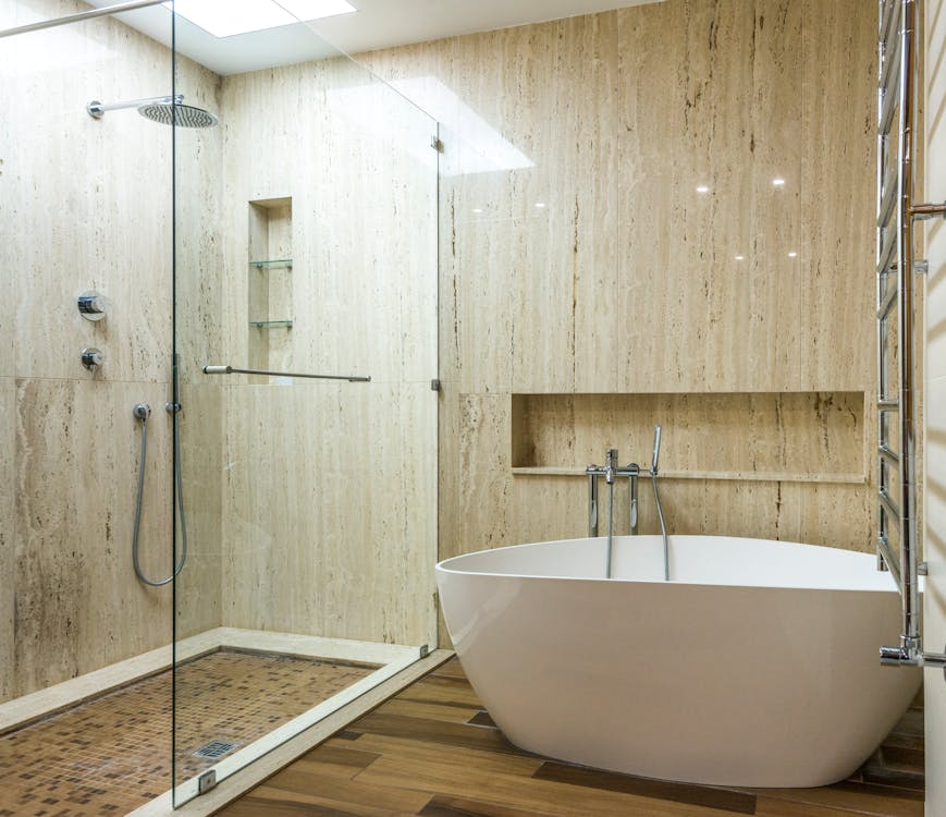 The freestanding tub has re-emerged as a defining centerpiece in contemporary bathroom updates.