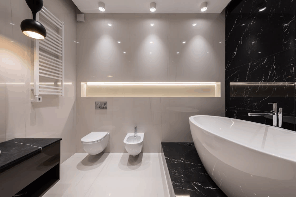 Contemporary bathrooms prioritize lighting as a key design element rather than a finishing detail.