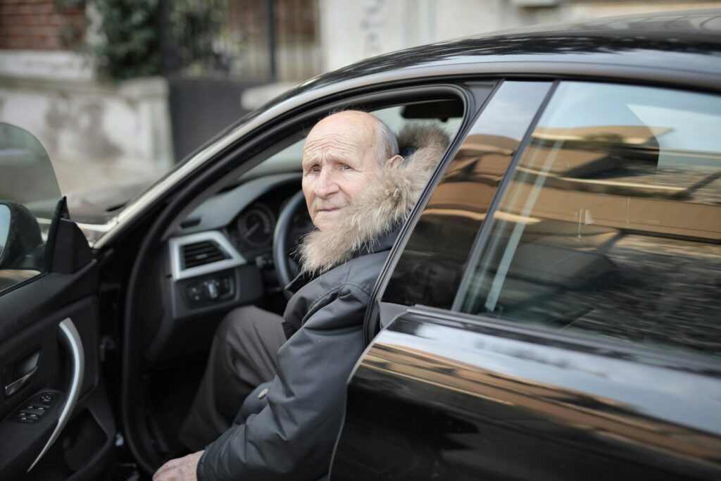 Elderly man in car, representing getting lost in familiar places.