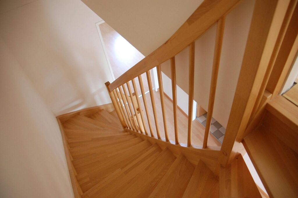 Wooden staircase, showing obstacles that become harder to manage.