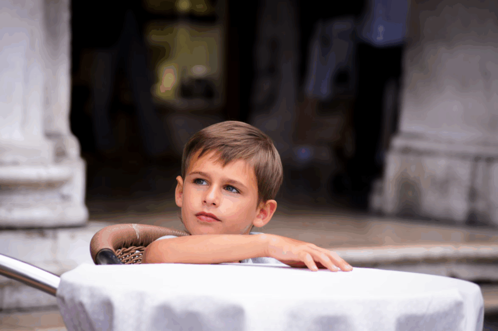 boy sitting at table