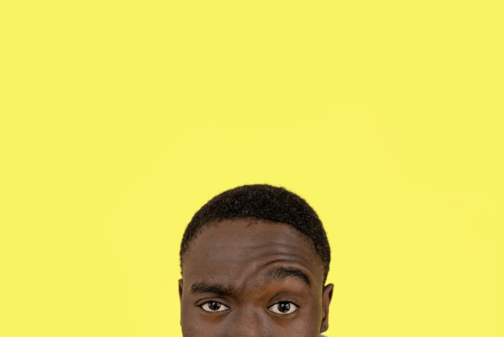 man with yellow background