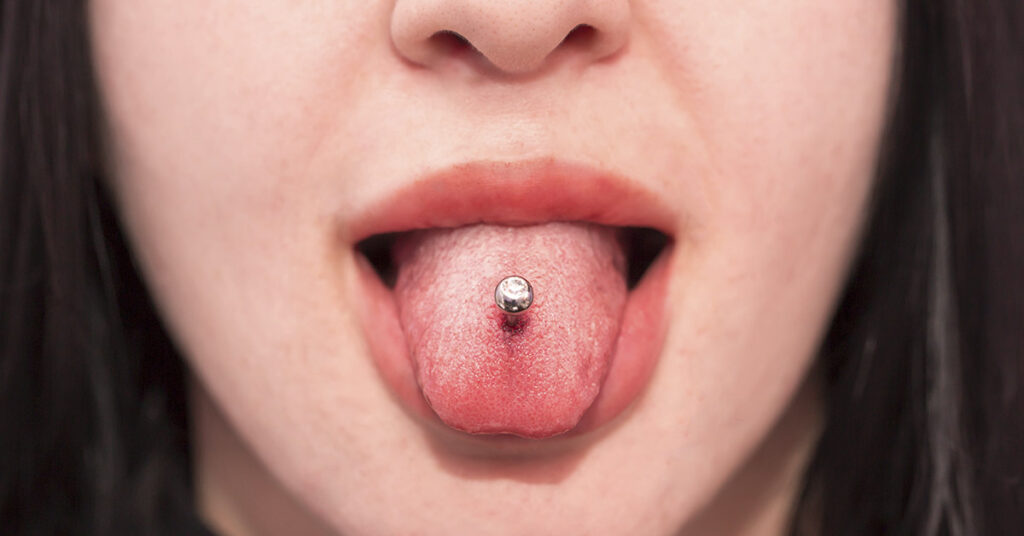 There’s More to Tongue Piercings Than You Might Think. Here’s What They Symbolize  and Why People Get Them - Featured image