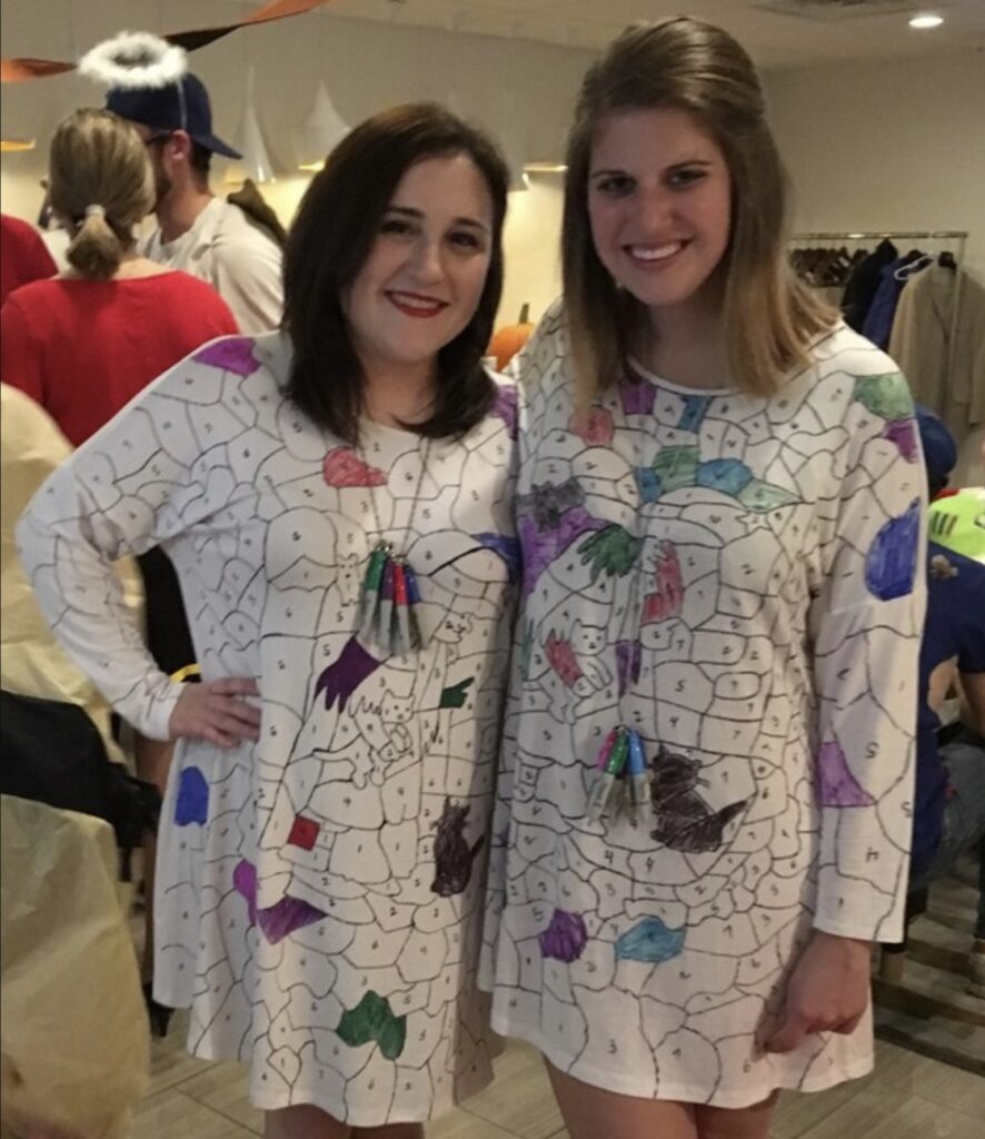 women wearing color by number Halloween costumes at a party