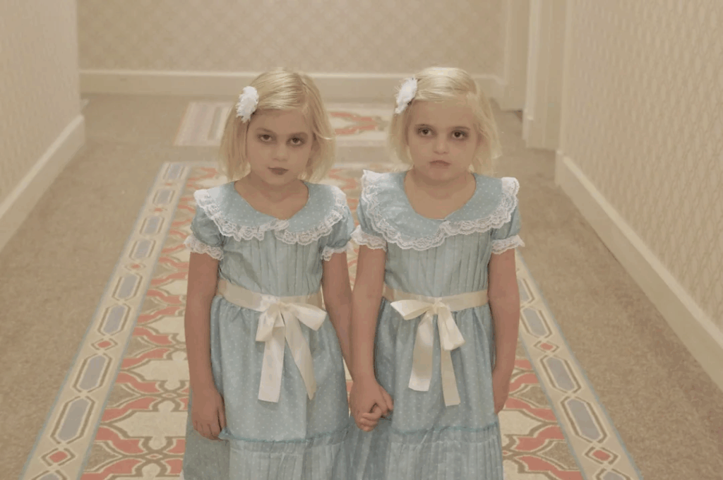 twin girls with blonde hair dressed in matching dresses