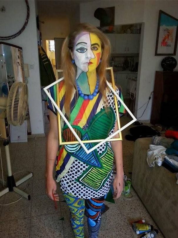 woman wearing picture frames and face paint