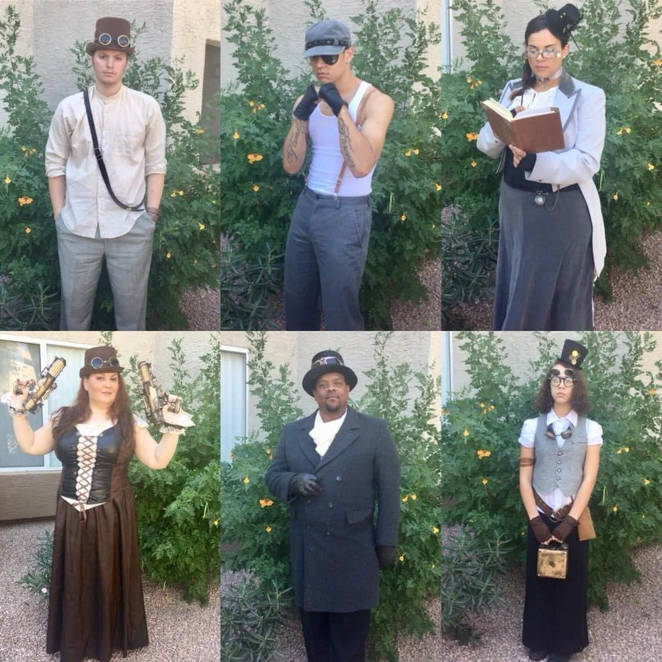 group of people dressed in Victorian and steampunk outfits