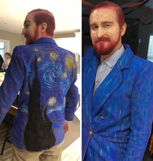 man wearing blue blazer and paint on his face