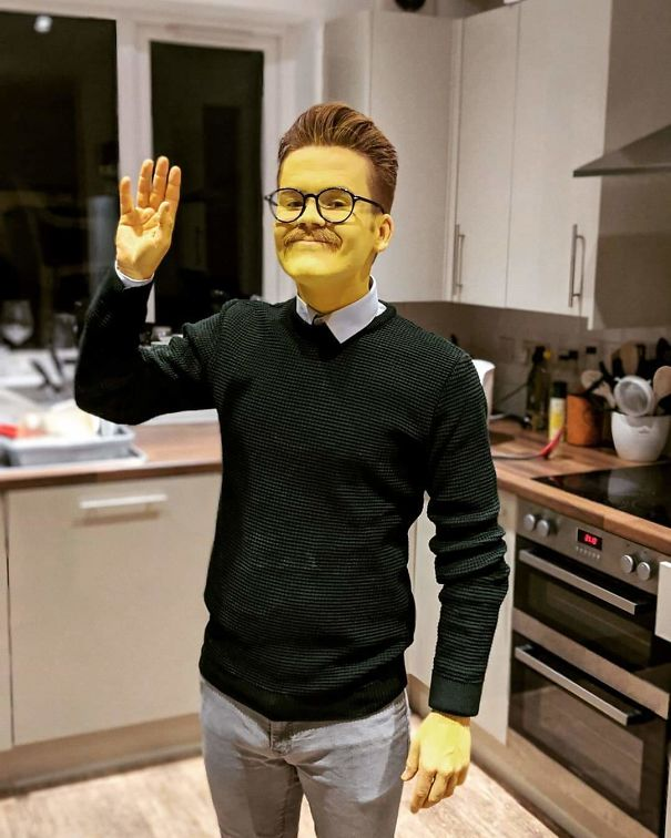 man wearing yellow face paint for creative Halloween costume