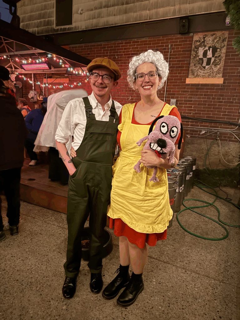 man and woman standing next to each other at event