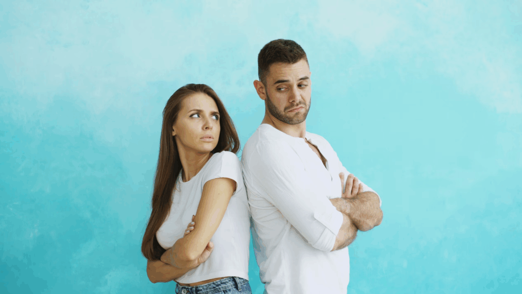man and woman looking at each other with concern