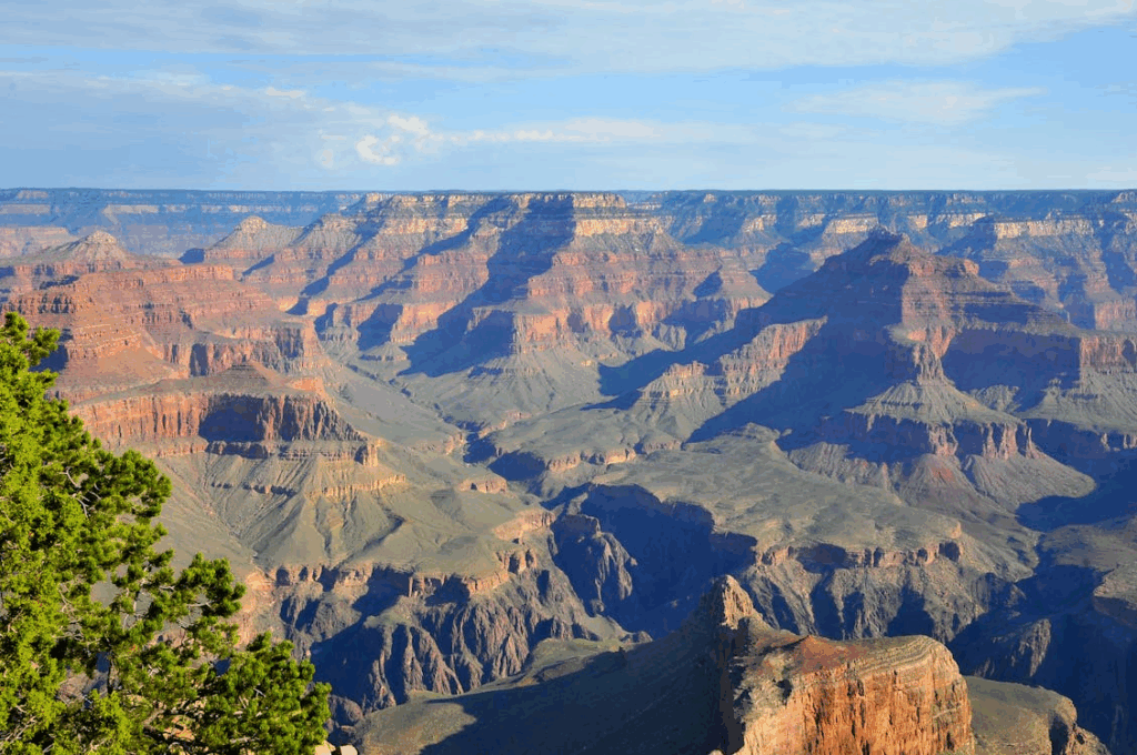 Sunrise paints the Grand Canyon in gold and crimson, revealing one of Earth’s most awe-inspiring natural wonders.