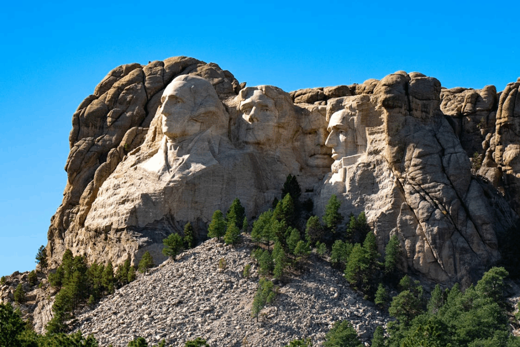 Mount Rushmore features the carved faces of four U.S. presidents, symbolizing national history within South Dakota’s Black Hills.