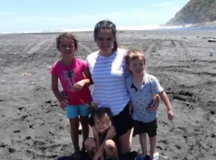 The children and mom on the beach