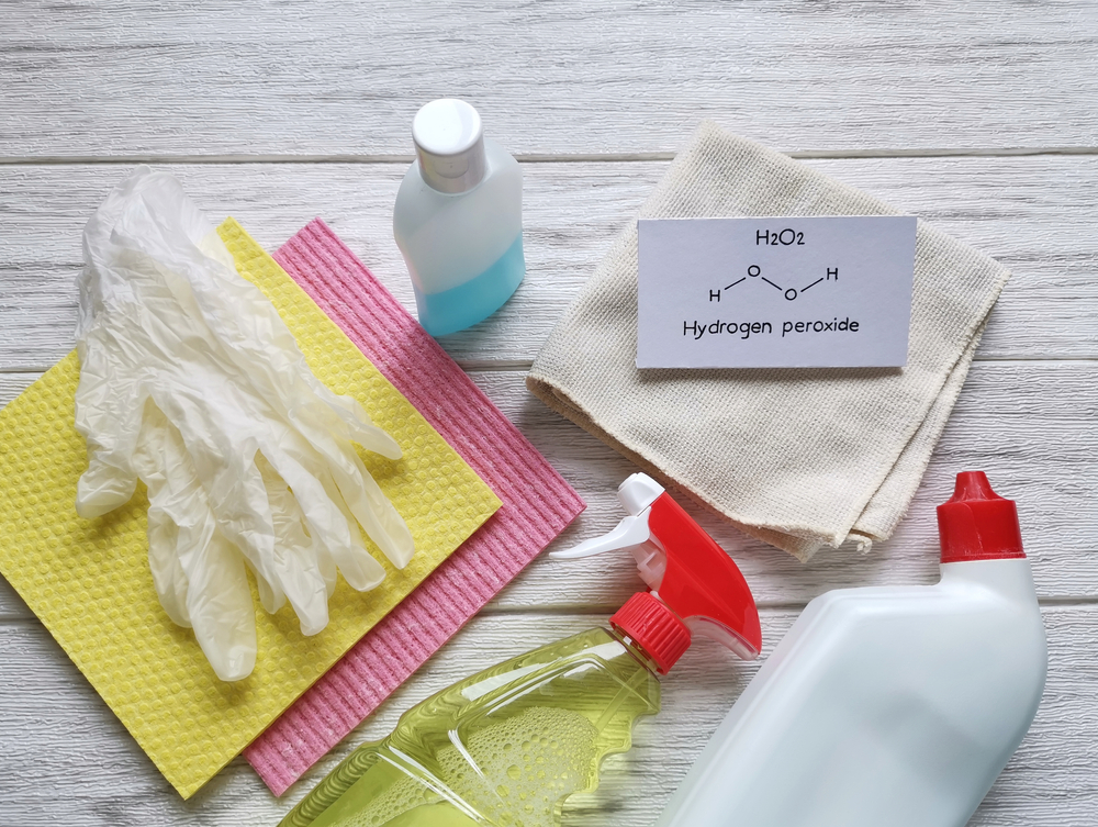 Structural chemical formula of hydrogen peroxide with cleaning products. Hydrogen peroxide is used as a bleaching agent or a disinfectant. Prevention of coronavirus disease (COVID-19), hygiene concept
