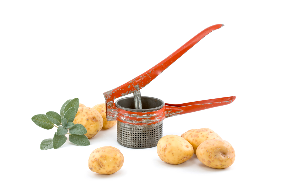 Green Glass Bowl with Vintage Egg Beater