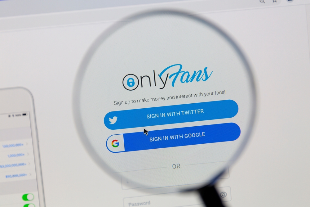 Ostersund, Sweden - September 6, 2021 Closeup of OnlyFans homepage under a magnifying glass. OnlyFans is an internet content subscription service and based in London.