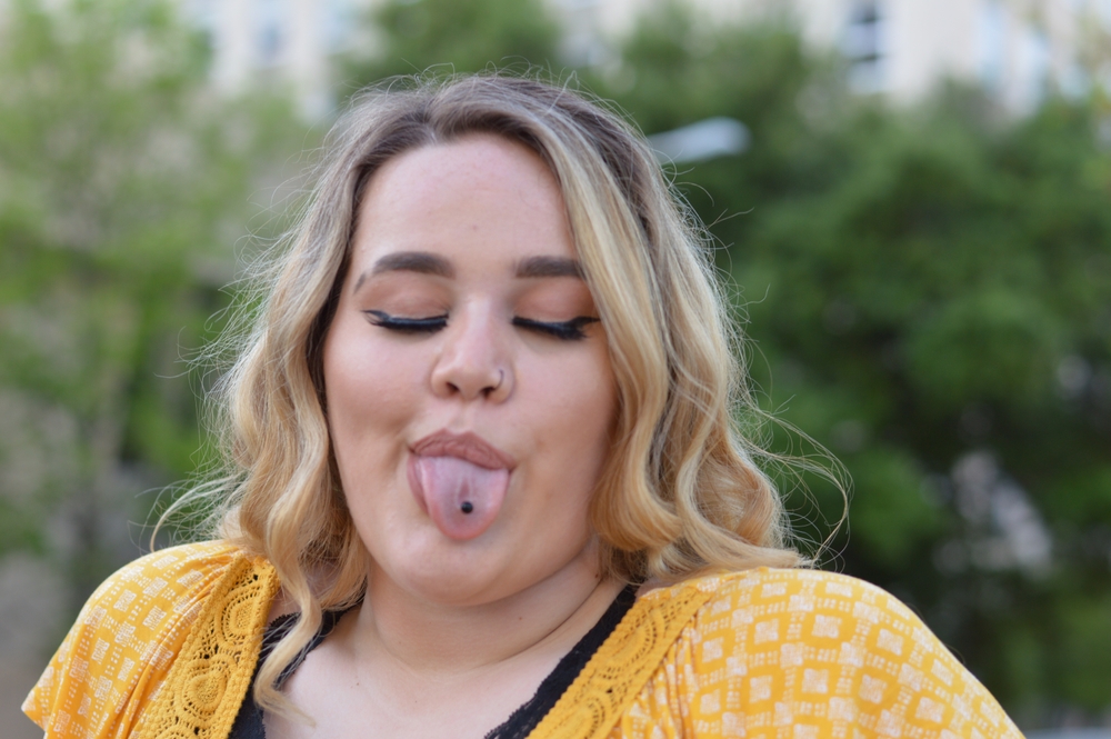 A young adult making a silly face