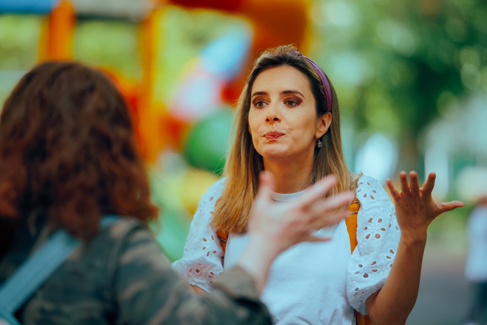Women Fighting Outdoors Reprimanding each other. Strangers starting a conflict on the street from random reasons