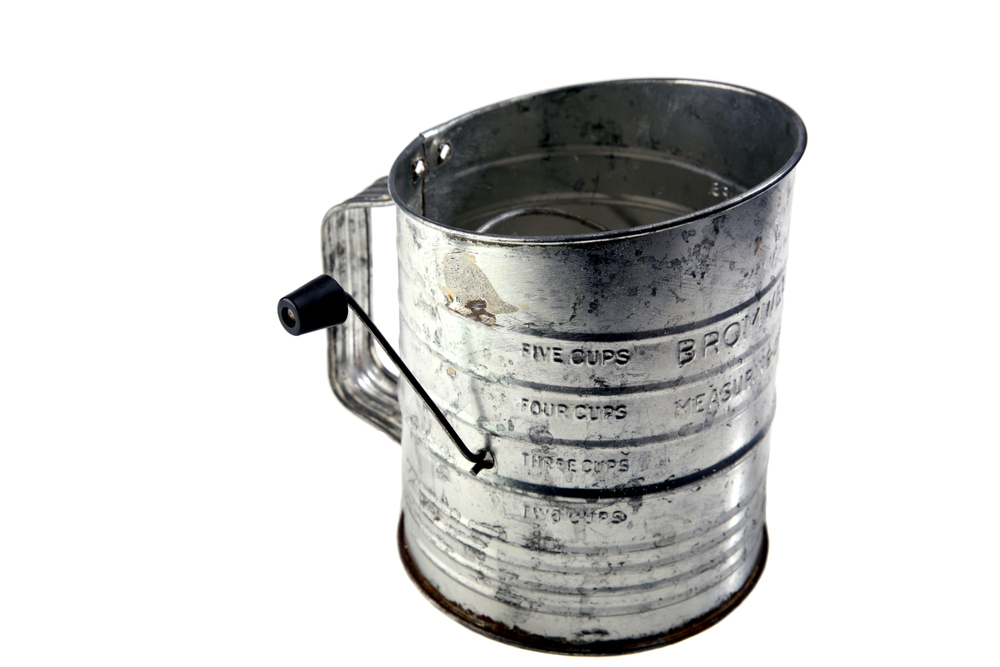 antique flour sifter isolated on white room for your text