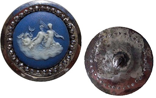 Antique decorative buttons with blue cameo design and metal border, front and back views.