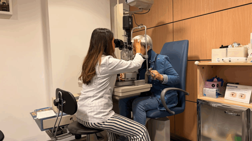 Optometrist Examining Patient with Slit Lamp
