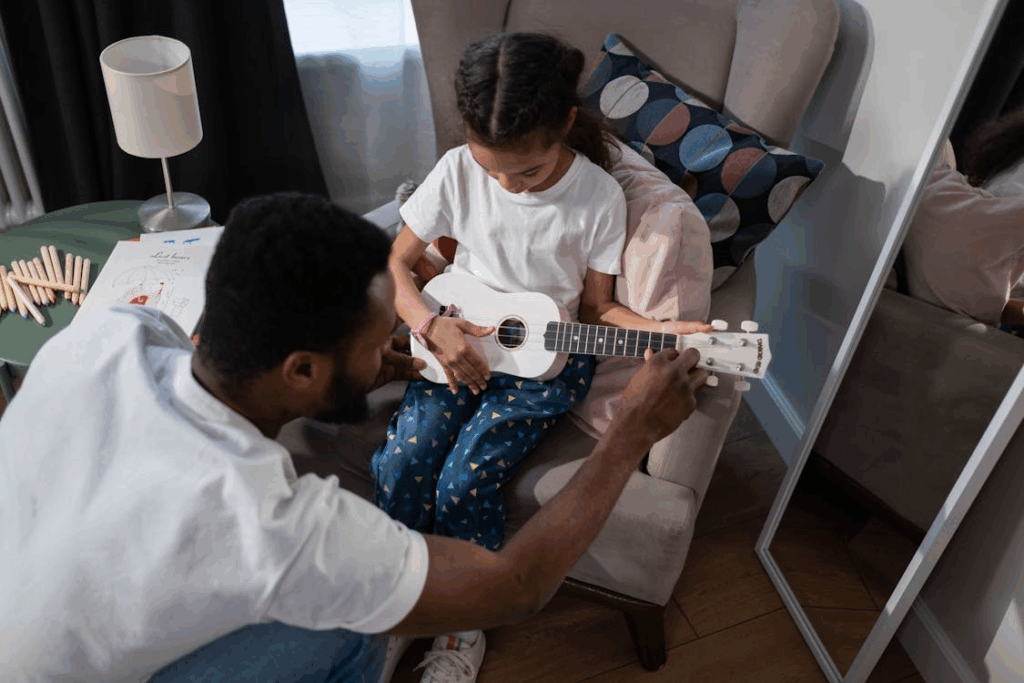 Father and Daughter Playing Ukulele