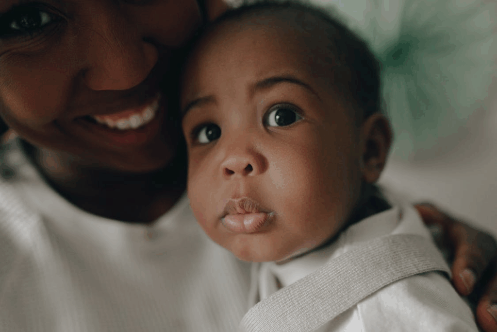 Toddler and a Woman in Close Up Photography