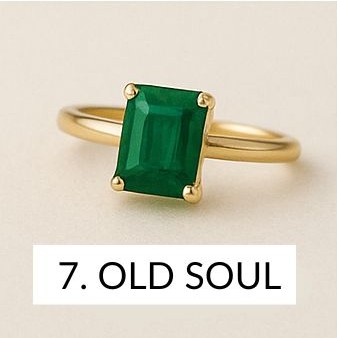 emerald rectangle stone on a gold ring
