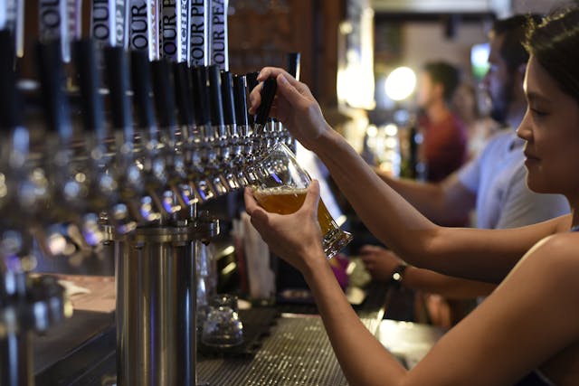 bar lady pouring drinks
