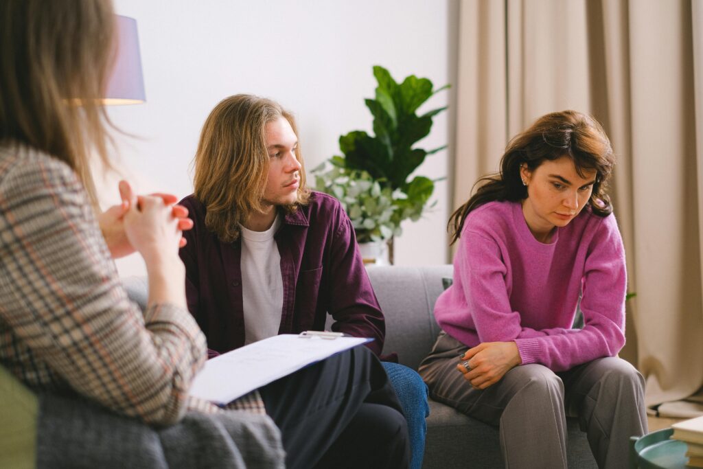 A Couple Having an Counseling to a Woman
