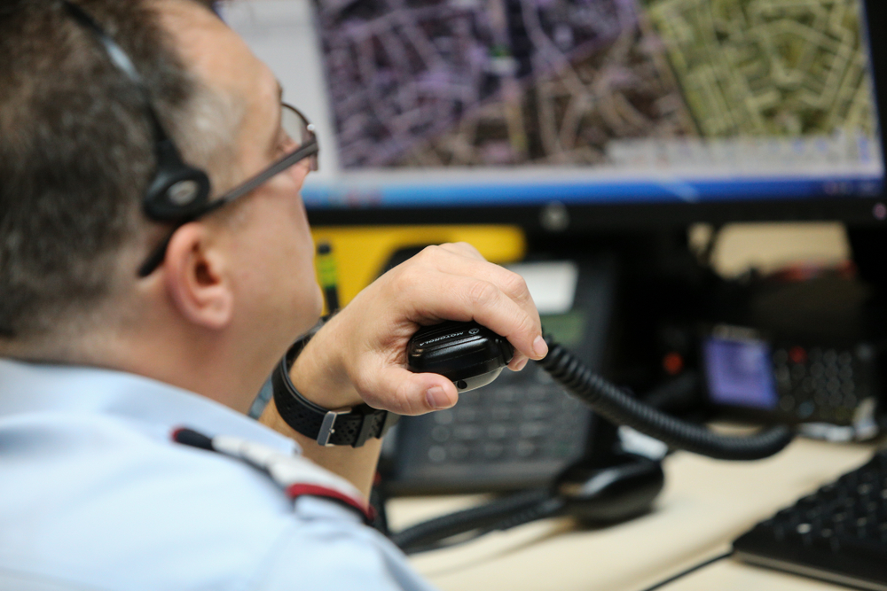 Bucharest, Romania - February 11, 2019: 112 emergency number operator (Romanian version of 911) having a conversation with a distress caller