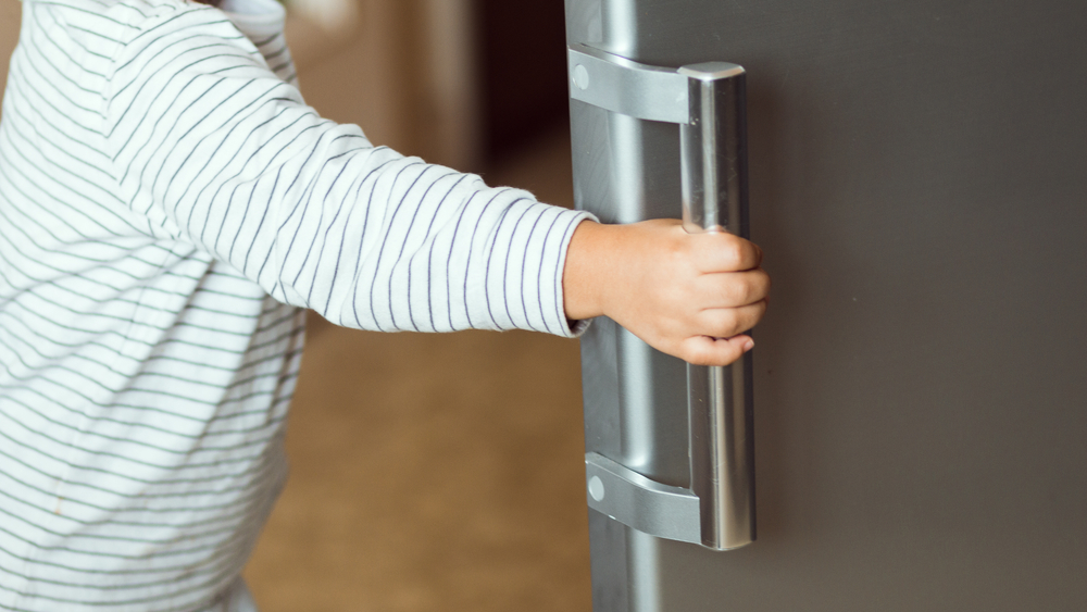 child opening the fridge, healthy food concept