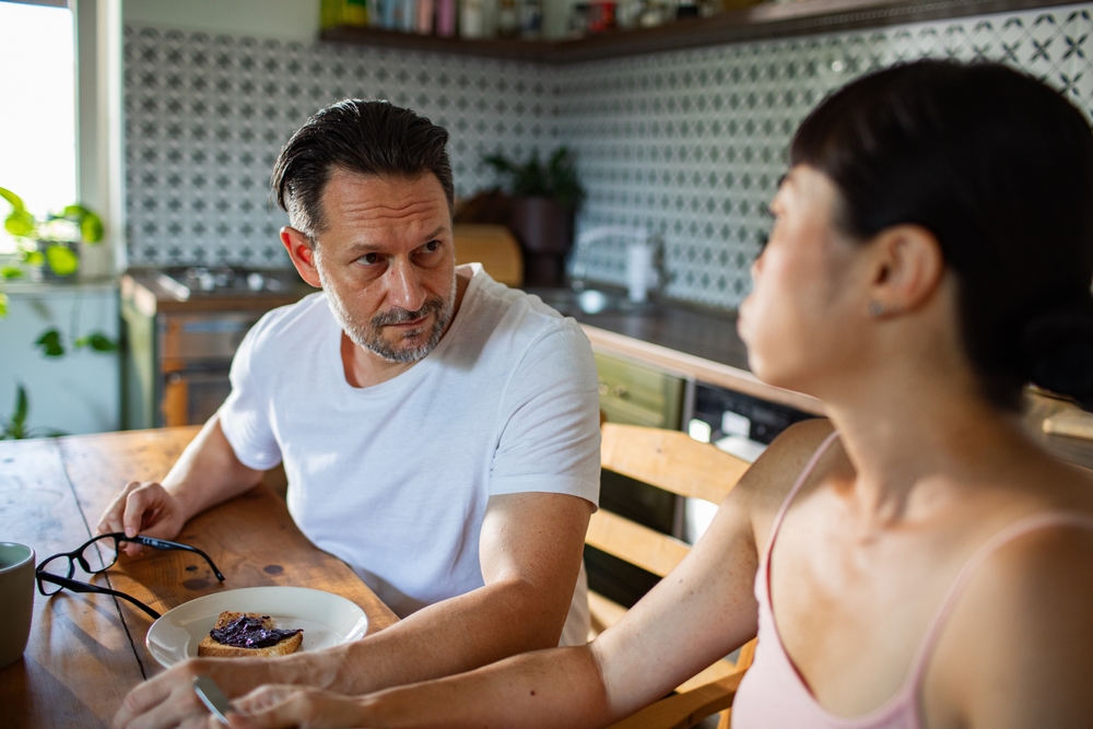 Couple having a serious conversation in the kitchen