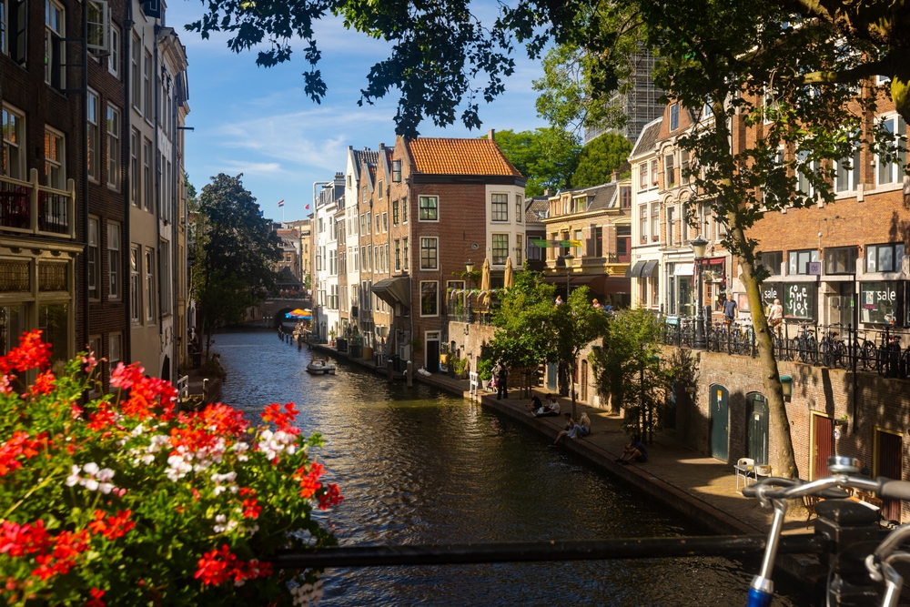 Utrecht, Netherlands - August 09, 2022: Traditional houses on the Oudegracht (Old Canal) in center of Utrecht, Netherlands
