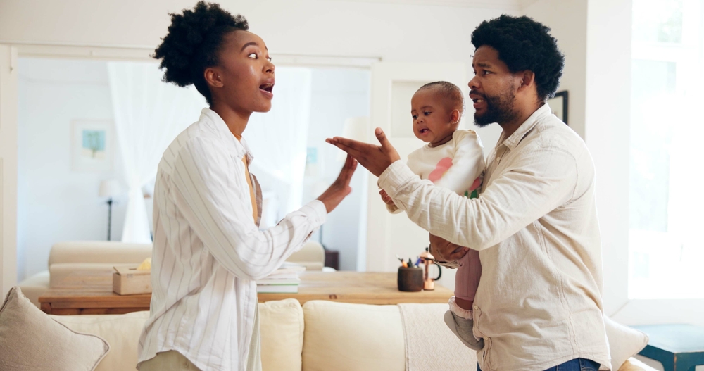 Black couple, argument and child with fight in home for disagreement, conflict or dispute. Frustrated, mom and dad with toddler in toxic relationship for breakup, divorce or confrontation in house