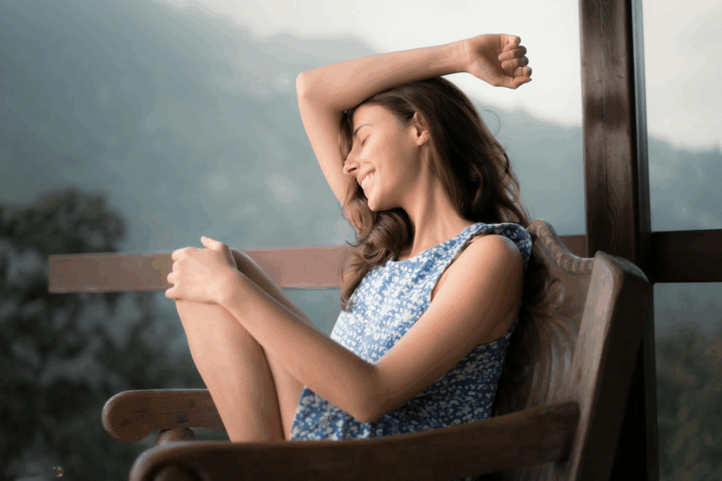 woman sitting in chair on porch outside