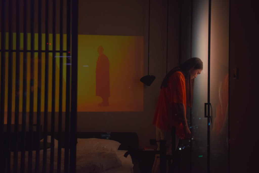 Restless Man leaning his Head against the Door
