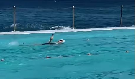 woman using phone in water
