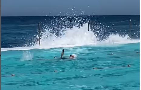 woman taking photos in pool