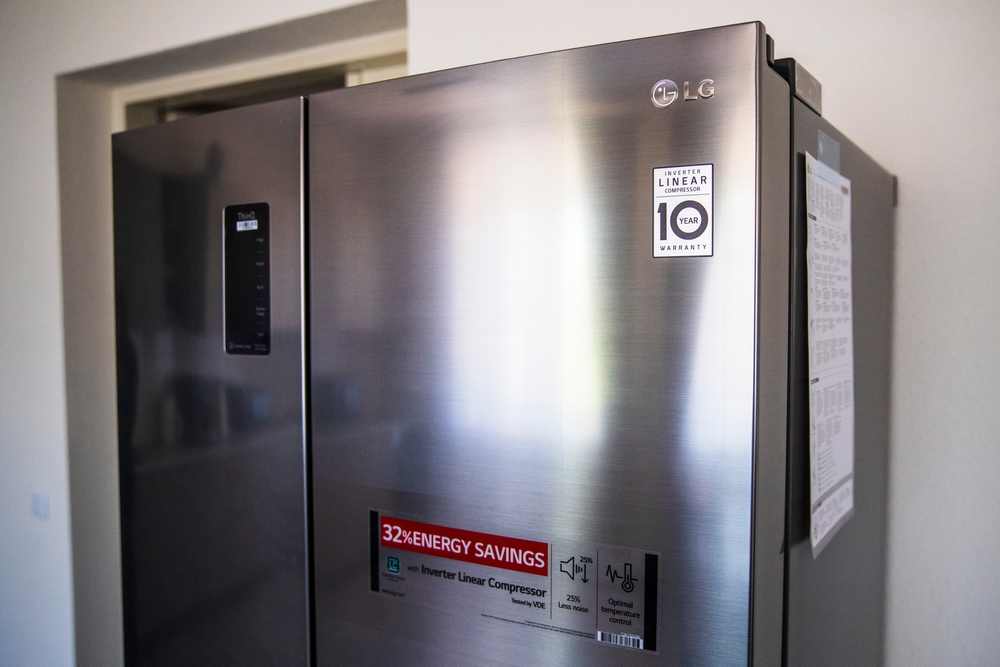 Vilnius Lithuania 2020-06-10
A modern LG stainless steel refrigerator with an inverter linear compressor, energy-saving label, and digital control panel, placed in a kitchen setting.