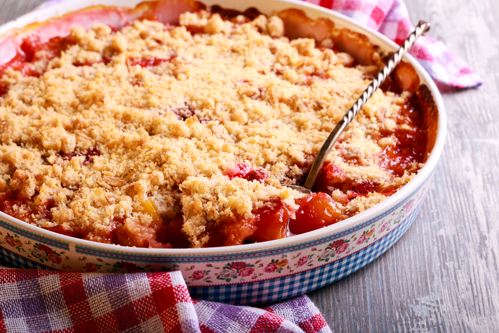 Mixed berry lattice topping pie on plate