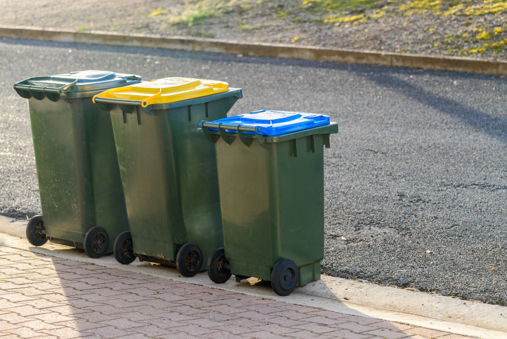 Kerbside waste bins ready for collection by local council in Australian suburb